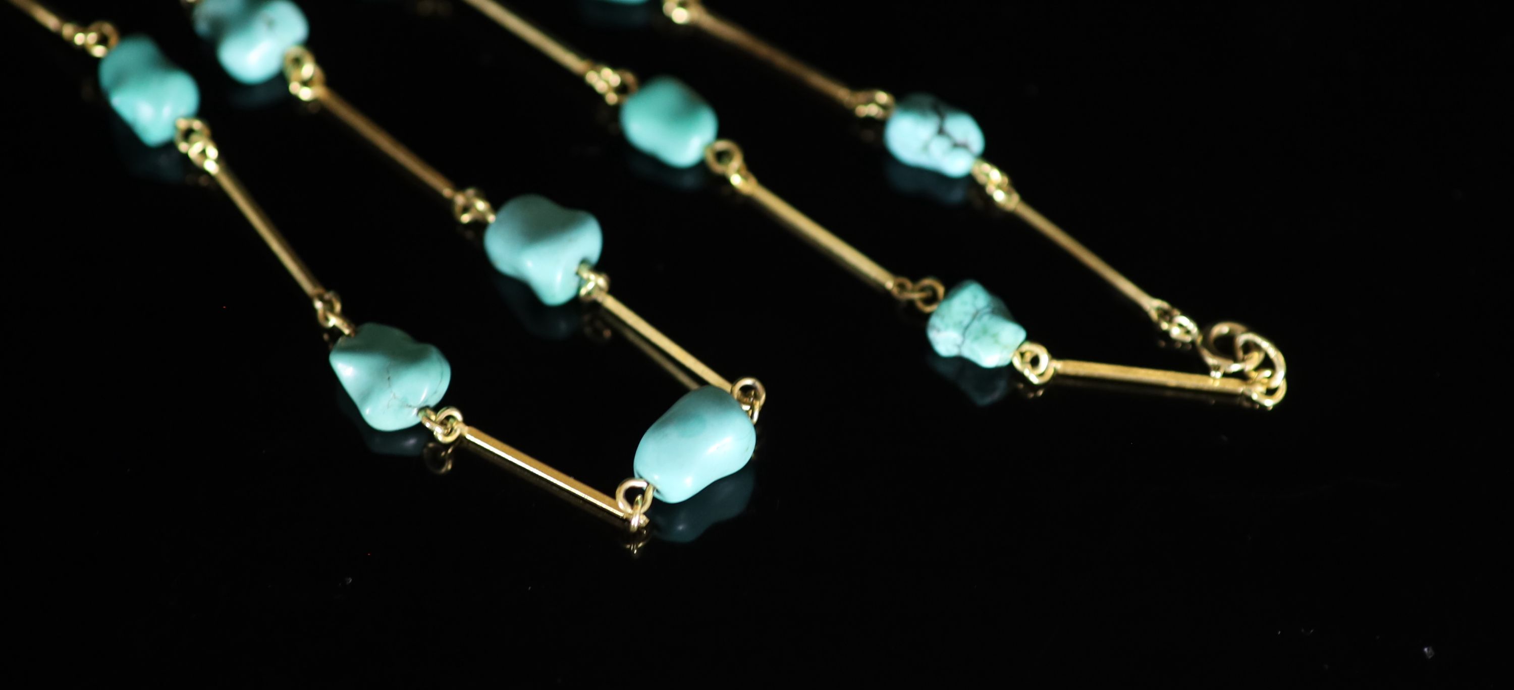 An early to mid 20th century Liberty & Co style gold baton link and turquoise pebble set necklace